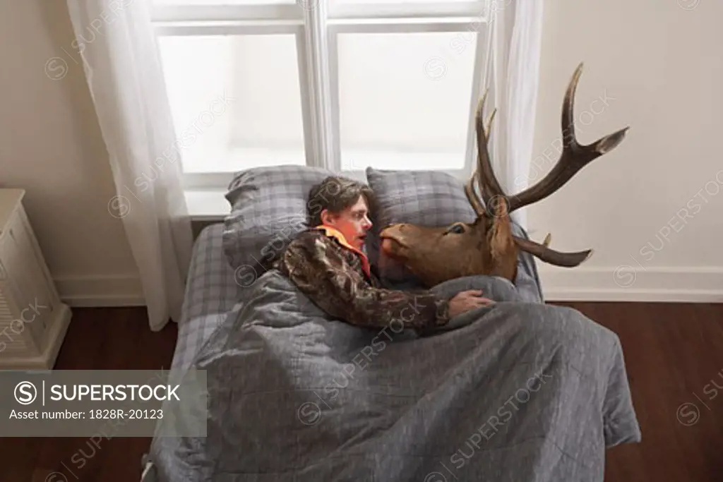 Hunter Sleeping with Deer Head   