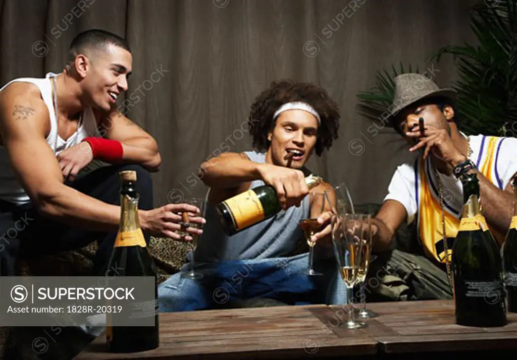 Men Smoking Cigars and Drinking Champagne   