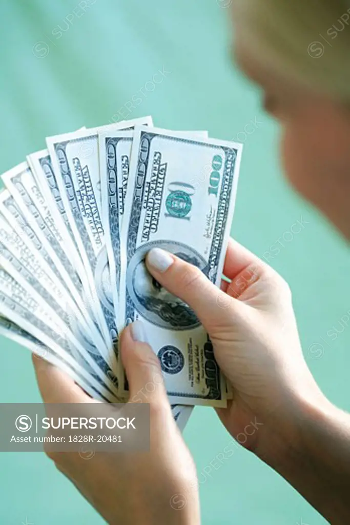 Woman Holding Cash   