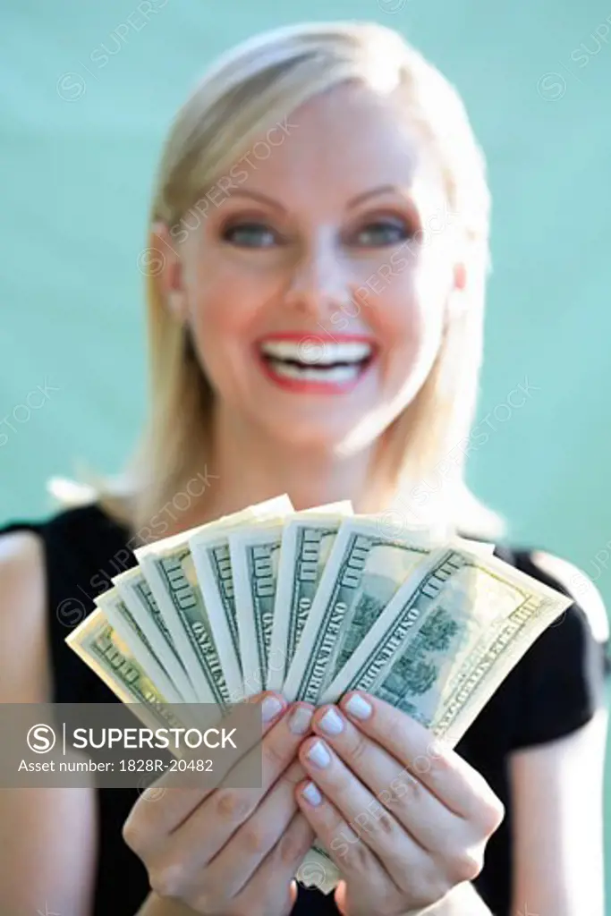 Woman Holding Cash   