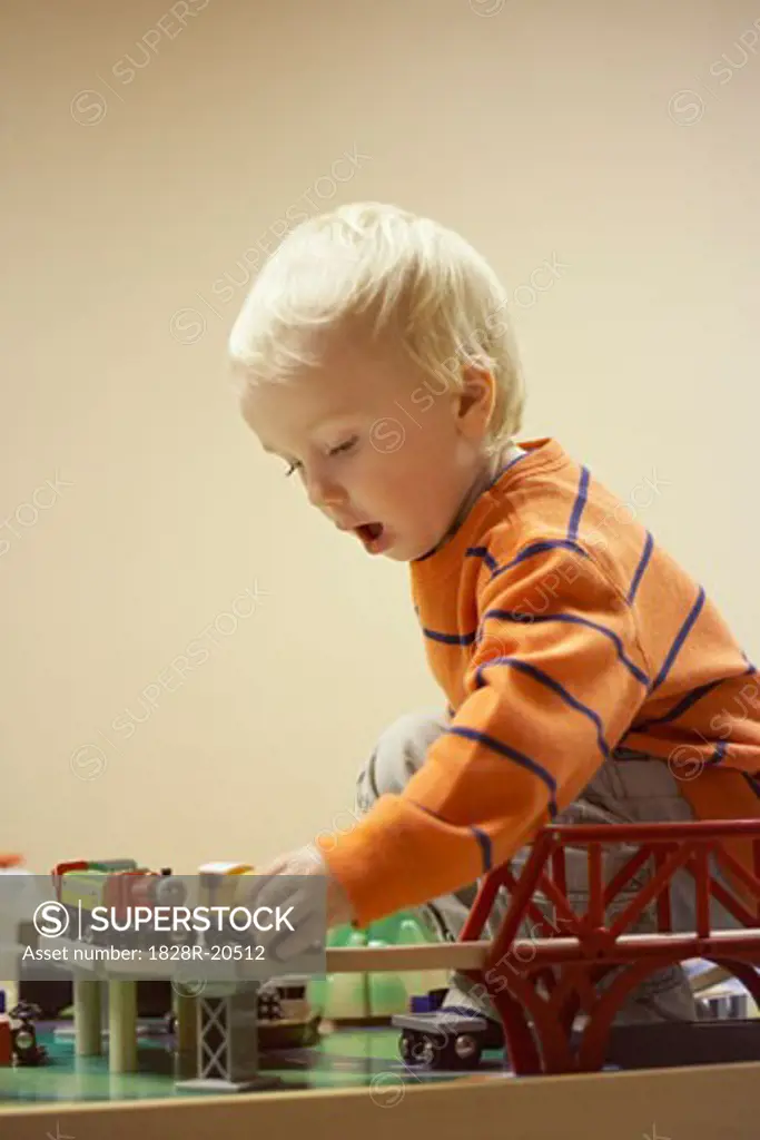 Boy Playing With Train Set   
