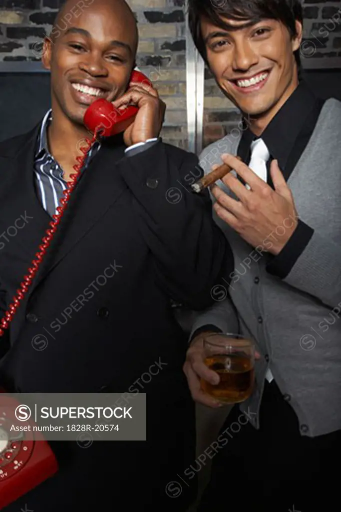 Man at a Bar Using a Red Telephone   