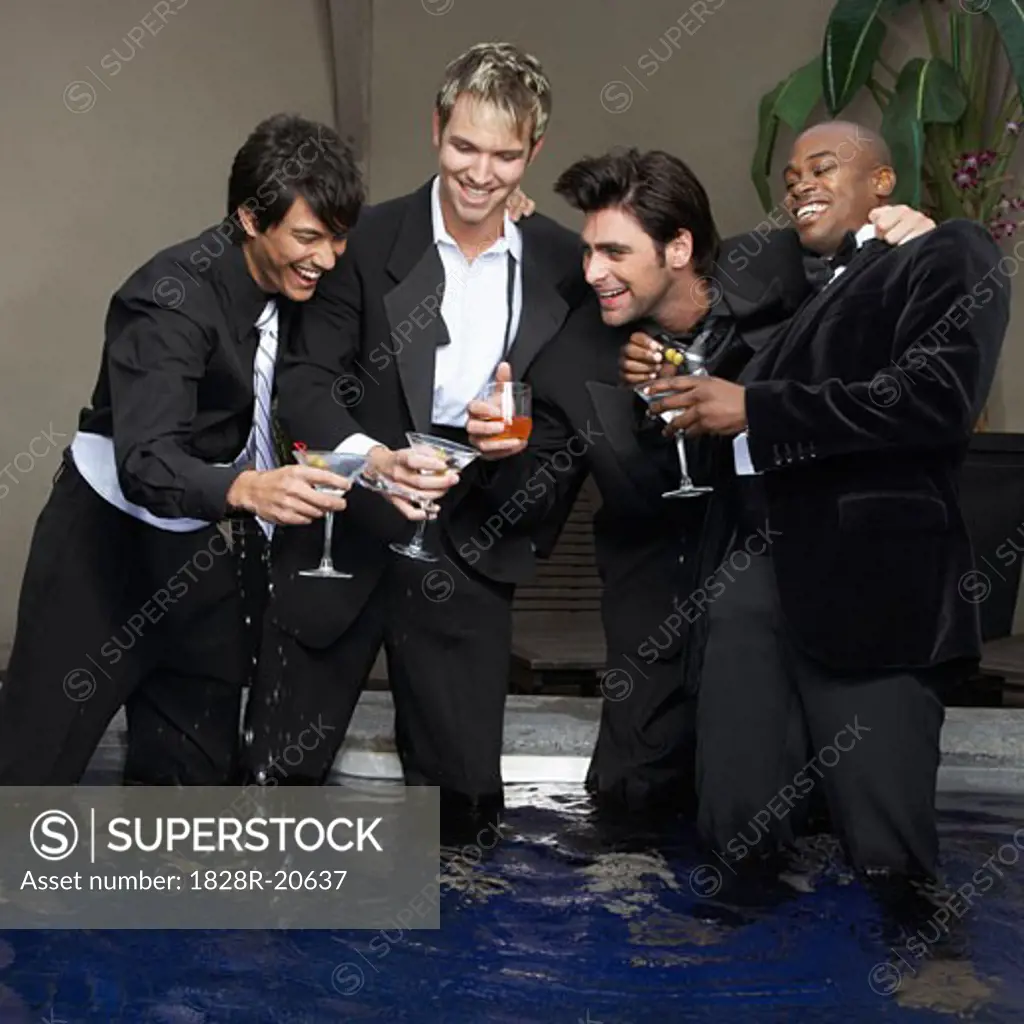 Men in Formal Wear Standing in Pool Drinking Cocktails   