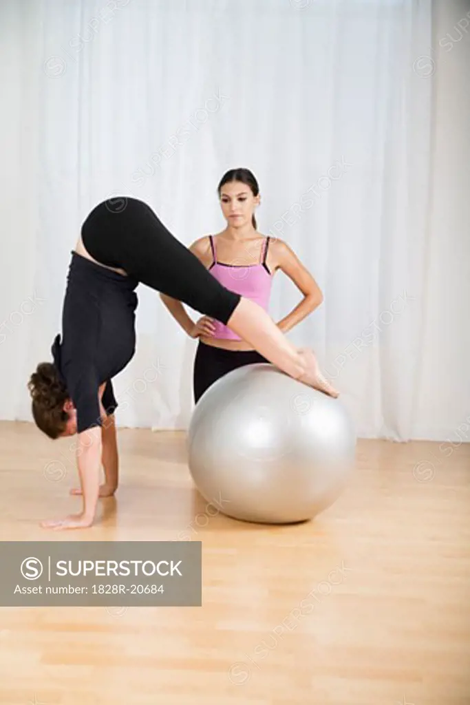 Woman Exercising with Trainer   