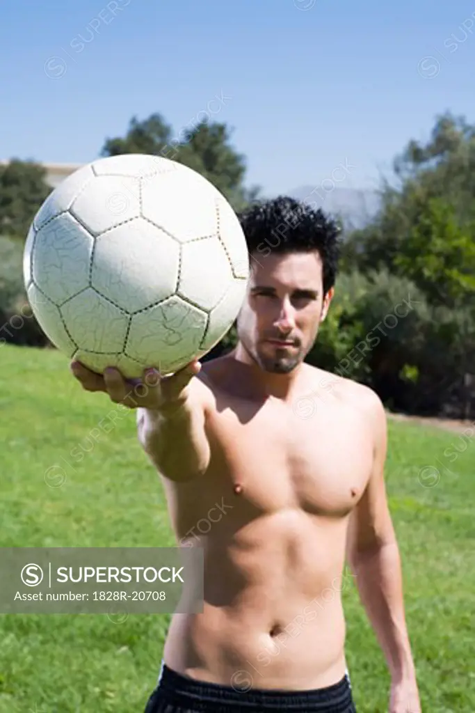 Portrait of Man with Soccer Ball   