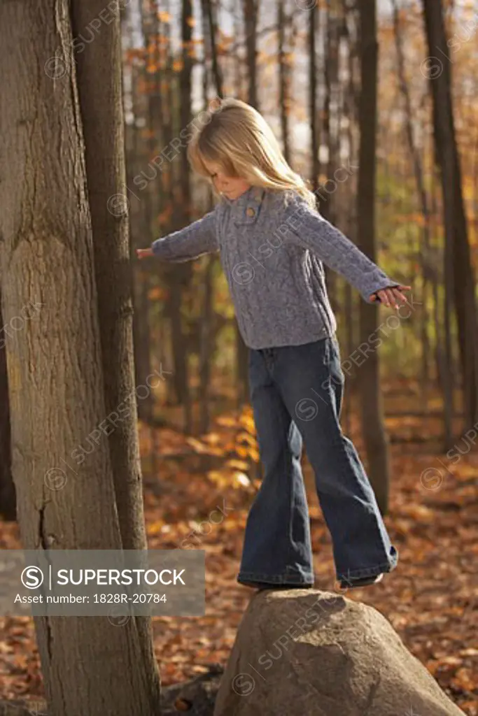 Girl Standing on Rock   