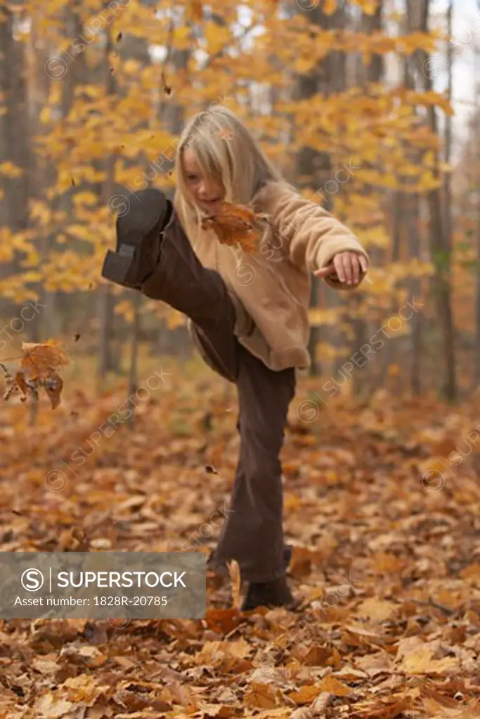 Girl Kicking Leaves   