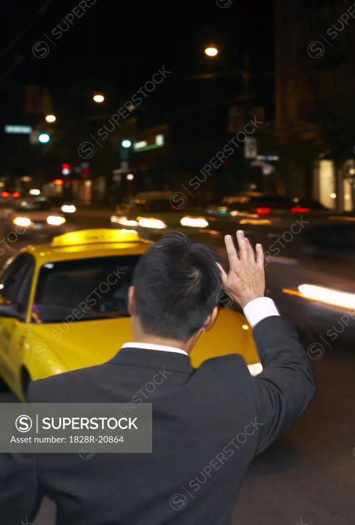 Man Hailing Cab at Night   