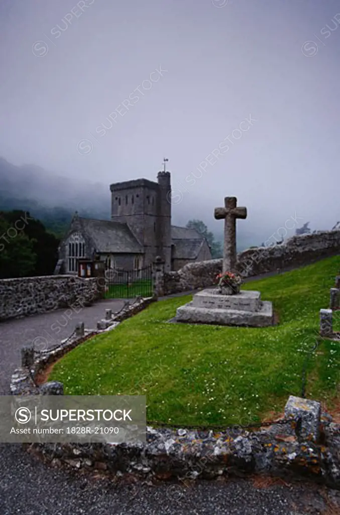 Cross at Graveyard by Church   