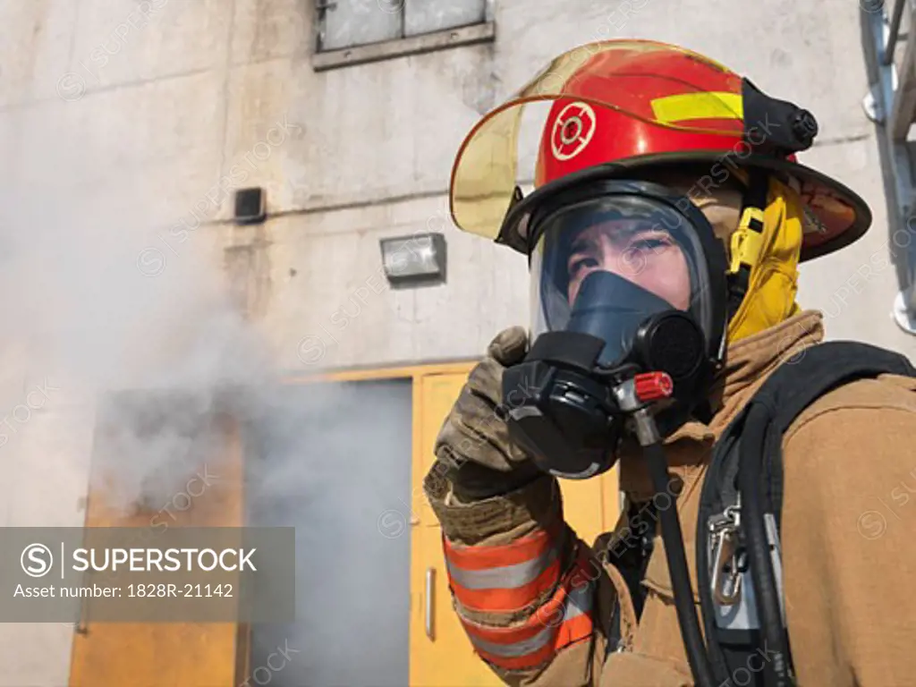 Firefighter Outside of Smoke-filled Building   
