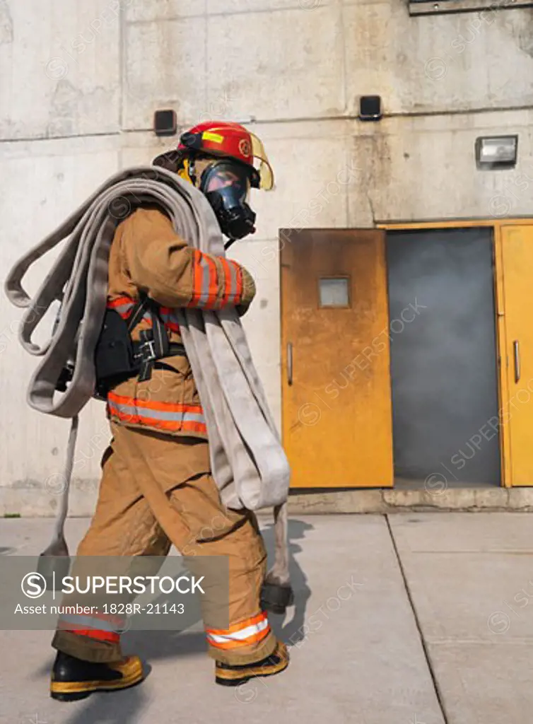 Firefighter Outside of Smoke-filled Building   