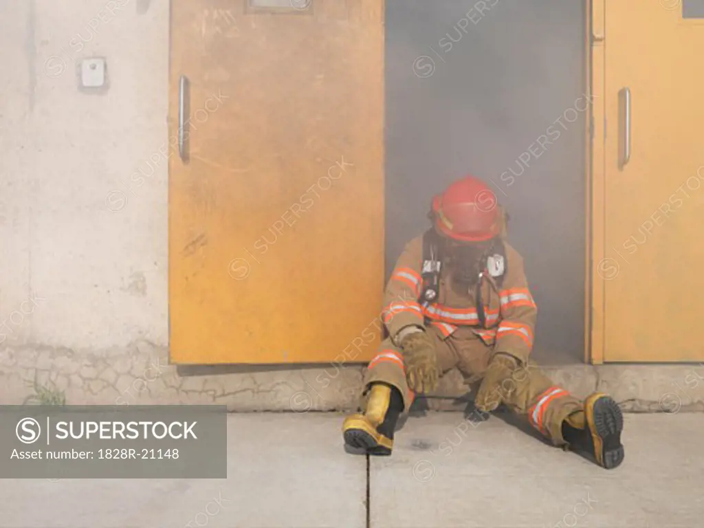 Firefighter in Doorway of Smoke-filled Building   