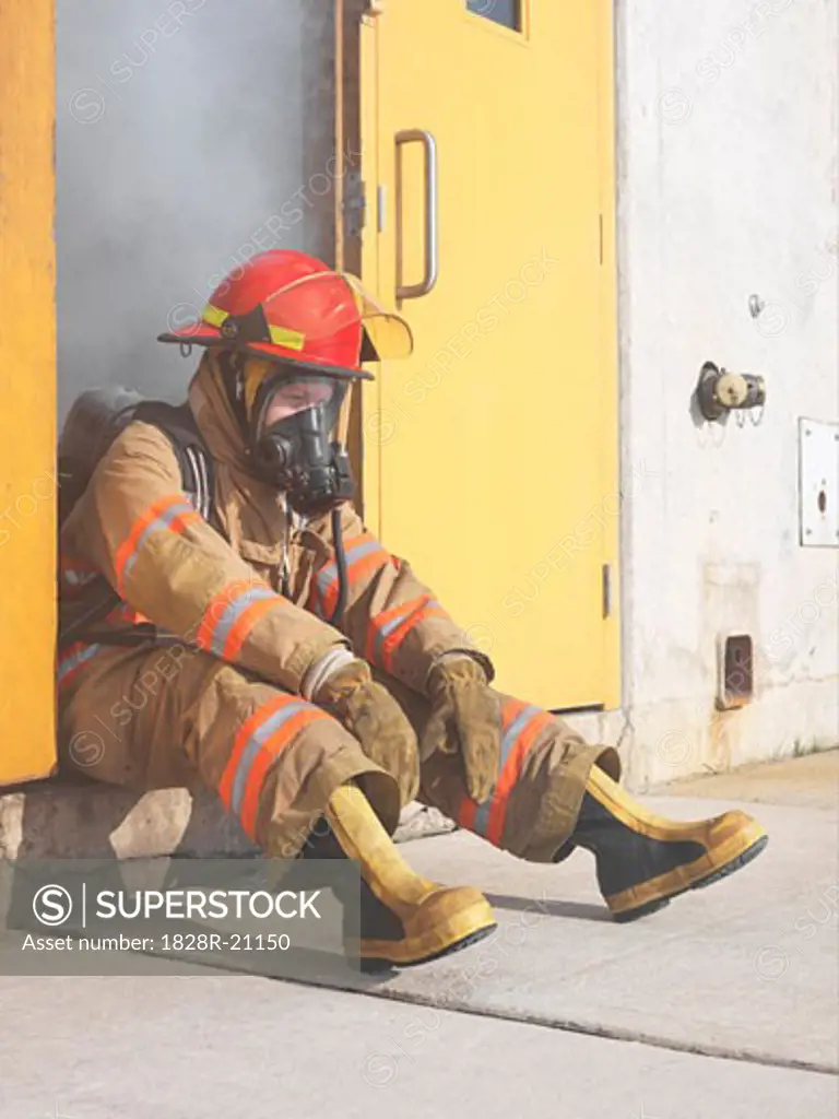 Firefighter in Doorway of Smoke-filled Building   