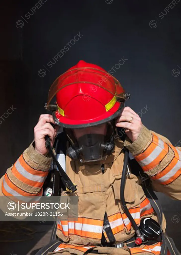 Firefighter Removing Oxygen Mask   
