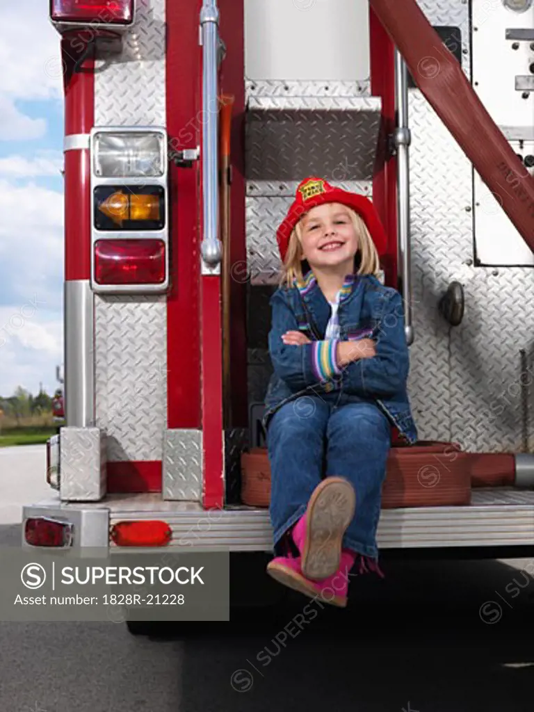 Girl on Back of Fire Truck   