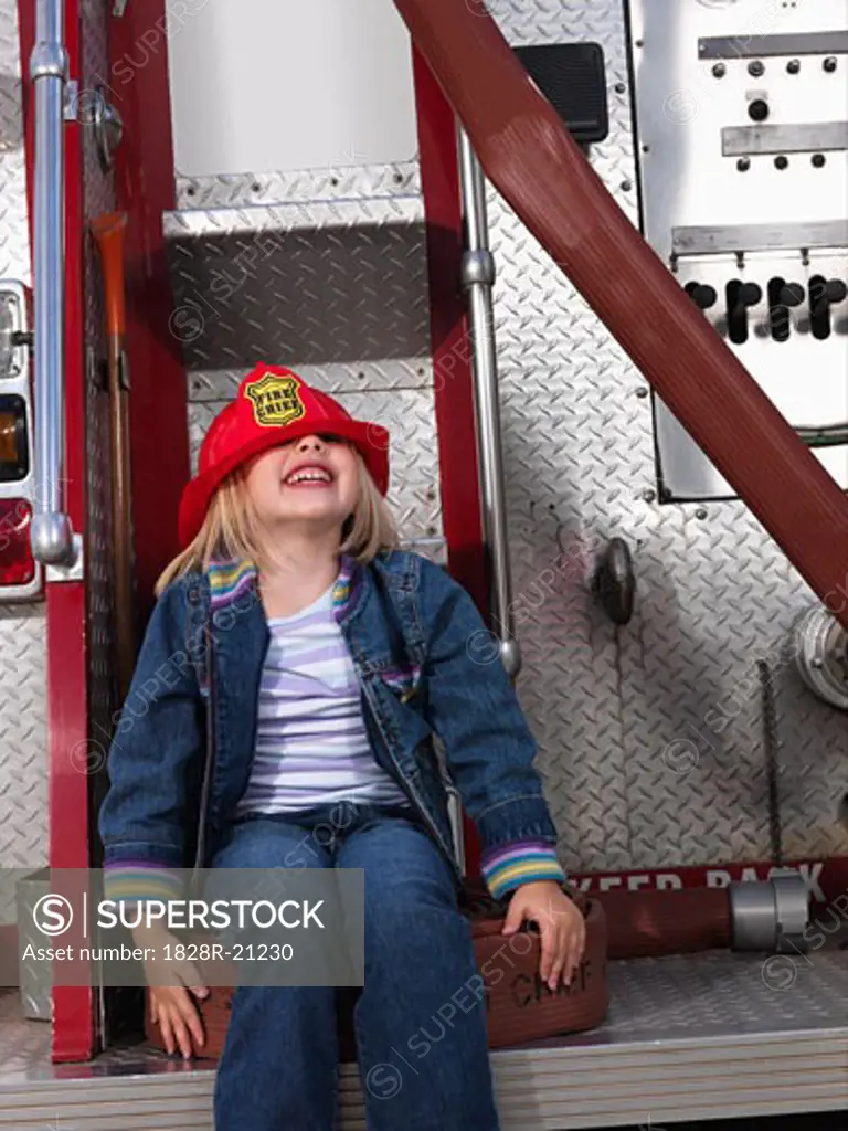Girl on Back of Fire Truck   
