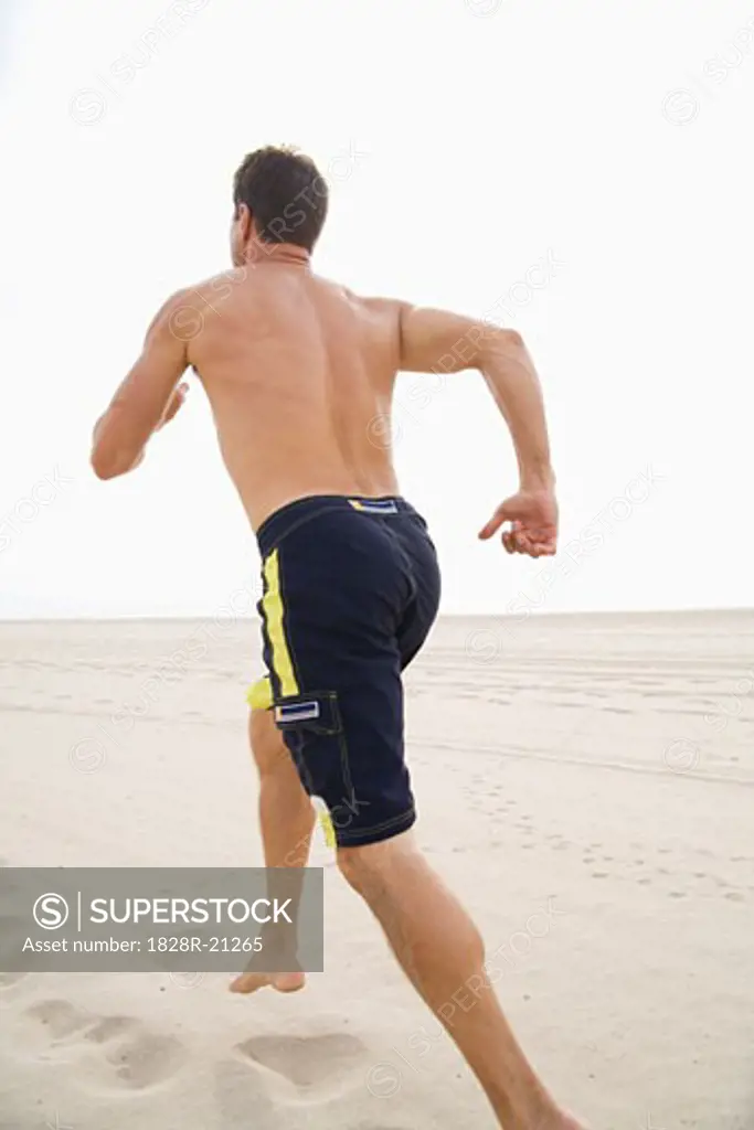 Man Running on Beach   
