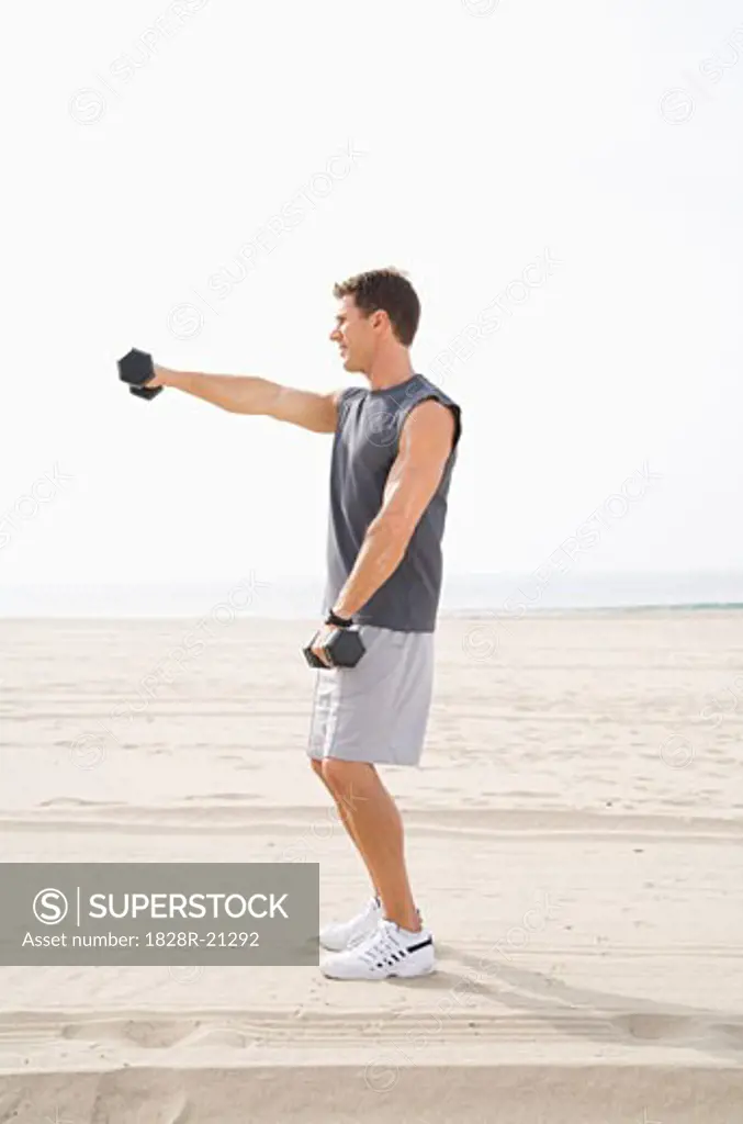 Man Exercising on Beach   