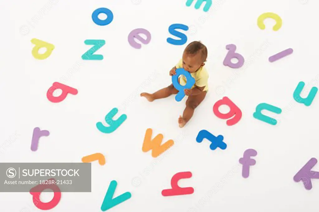 Baby Surrounded by Letters   