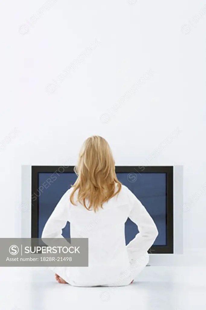 Woman Sitting in Front of Television   