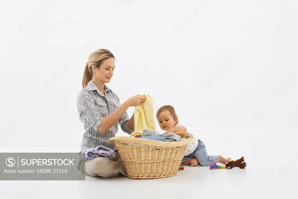 Mother and Baby Folding Laundry   