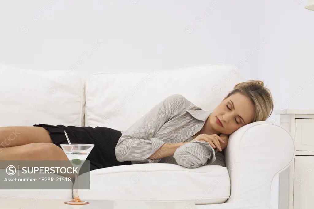 Businesswoman Sleeping on Sofa   