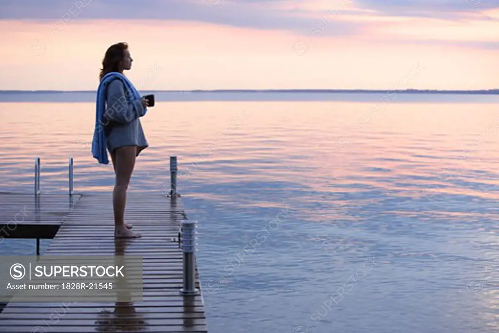 Woman on Dock by Water   