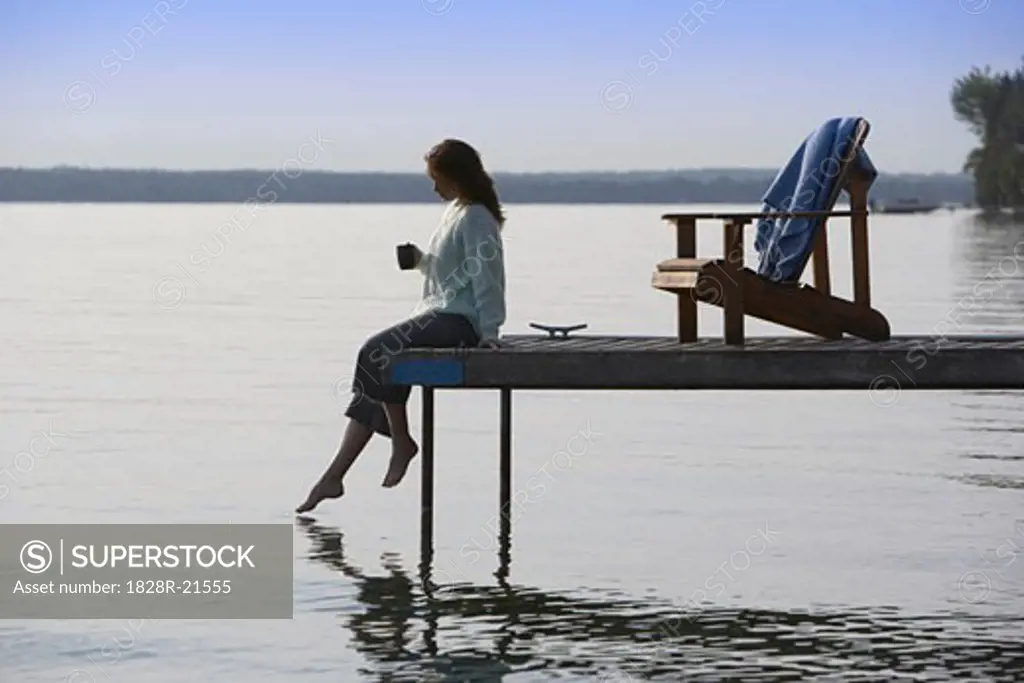 Woman Relaxing on Dock   