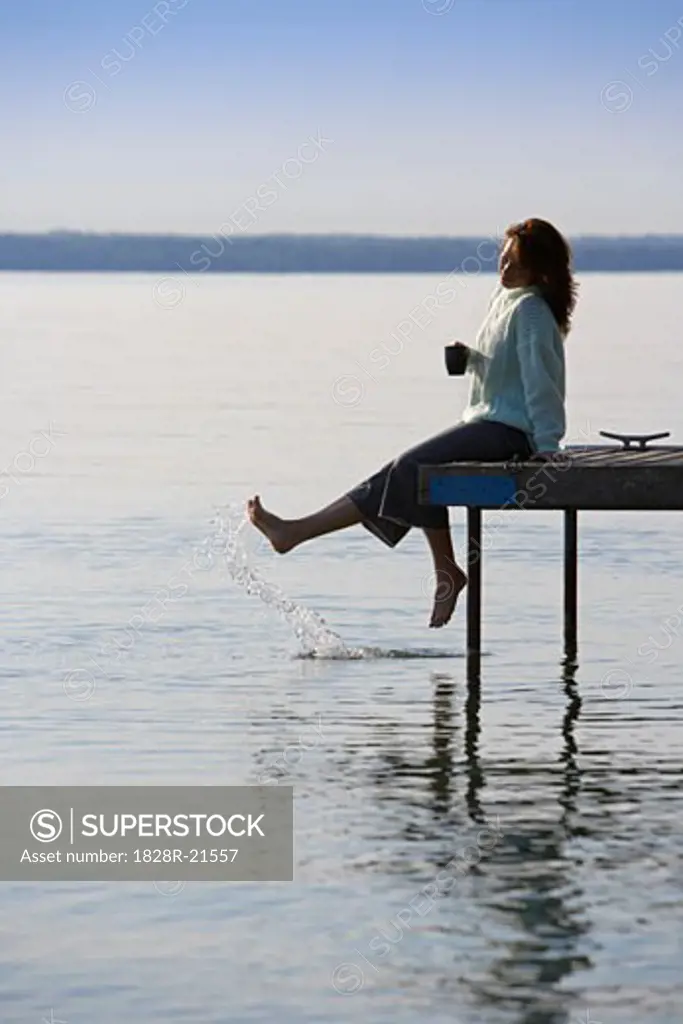 Woman Relaxing on Dock   