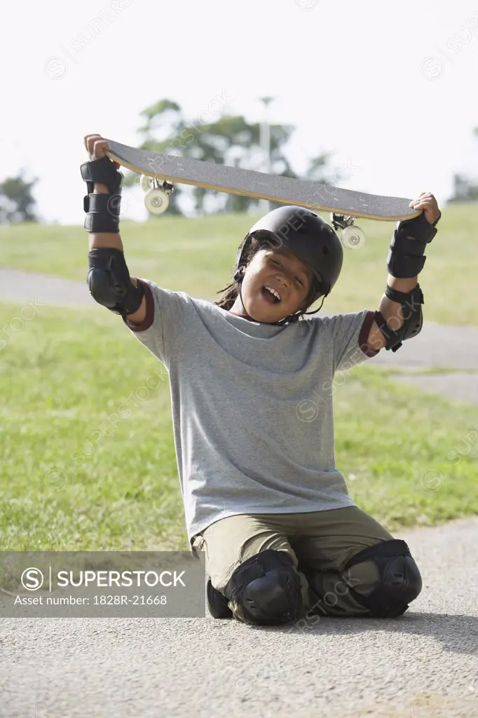 Boy Holding Skateboard   