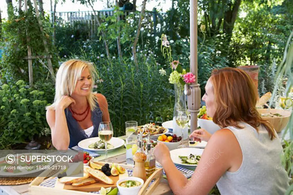 Women Eating Outdoors   