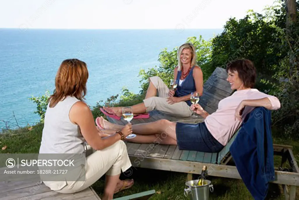 Women Drinking Wine Outdoors   