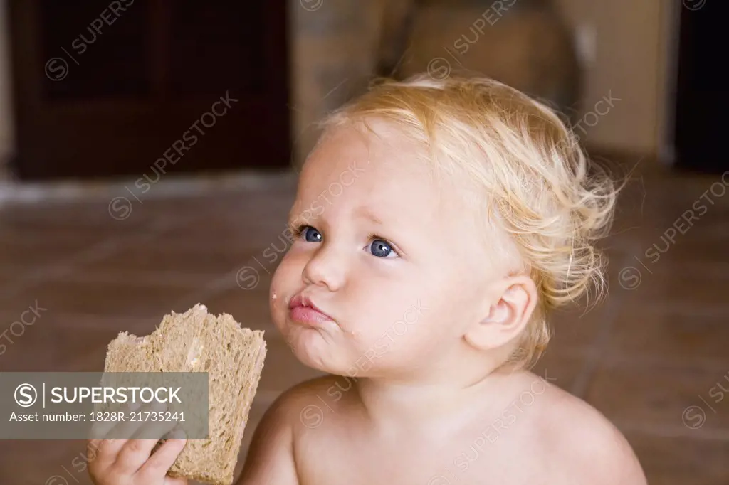 Baby Eating Piece of Bread   