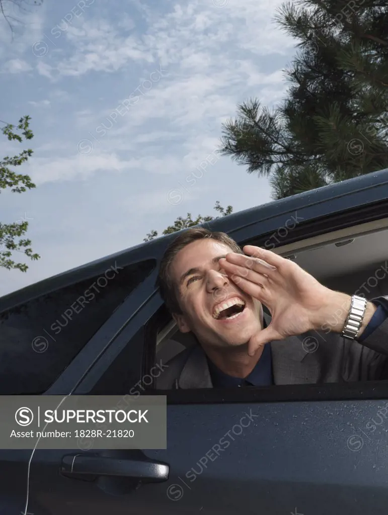 Businessman Shouting from Car   