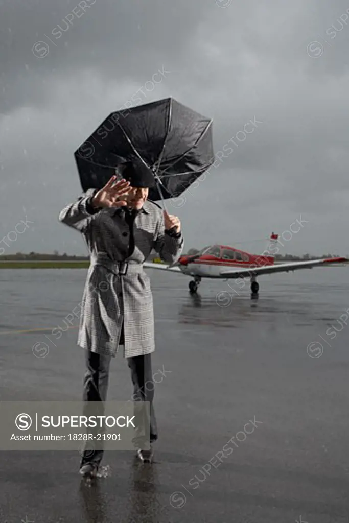 Man Caught in Storm on Airport Tarmac   