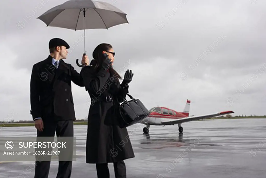 Man and Woman on Airport Tarmac   