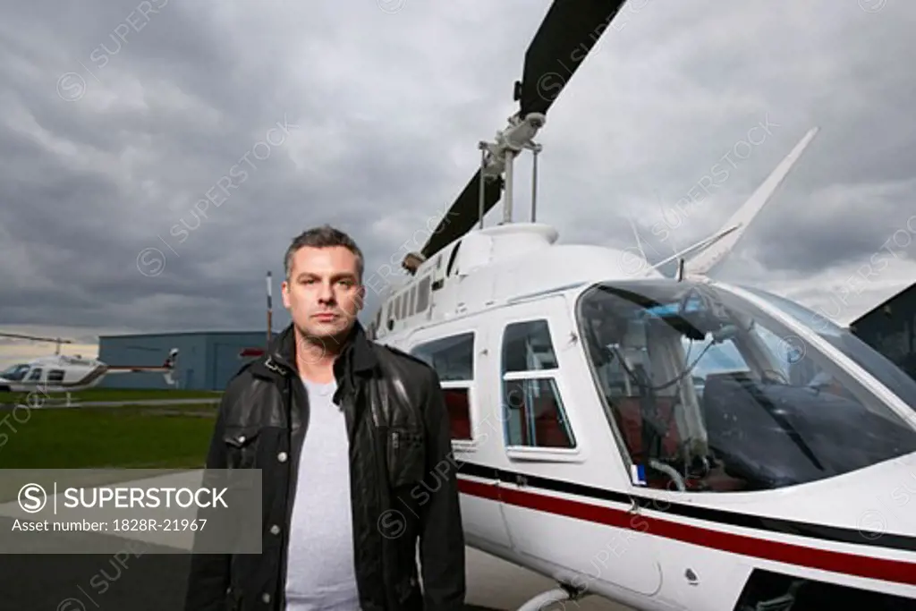 Portrait of Man Beside Helicopter   