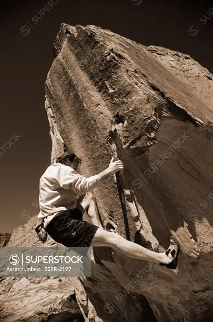 Man Rock Climbing Moab, Utah, USA   