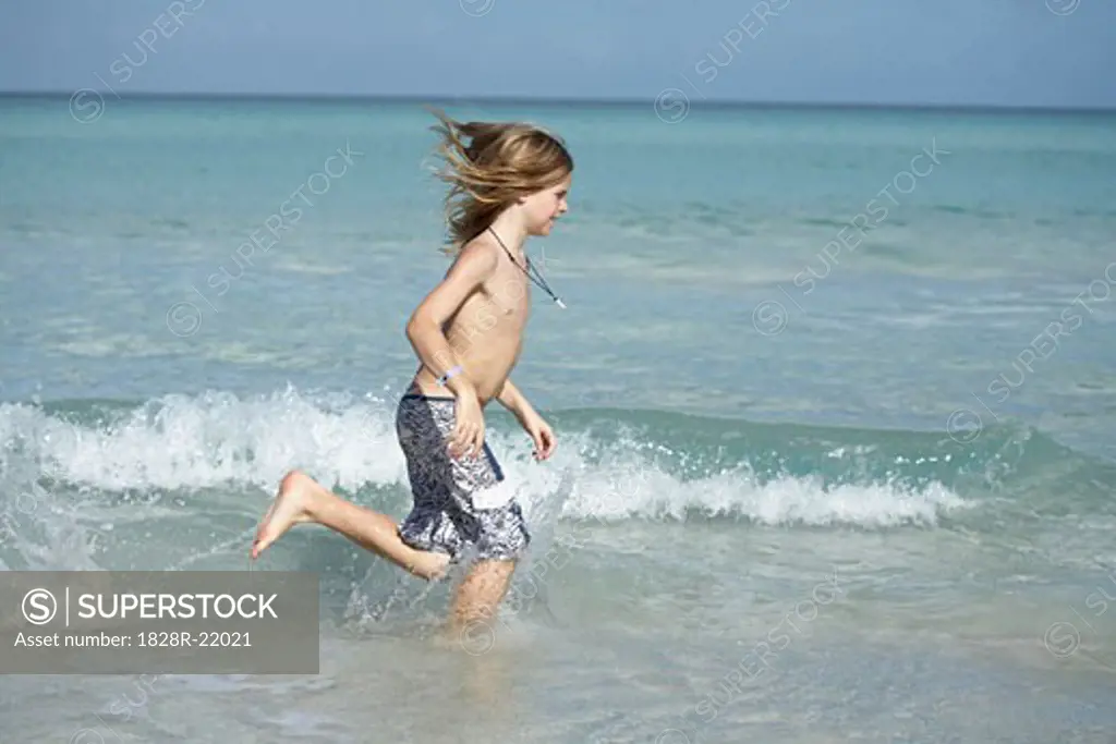 Boy Running on the Beach   