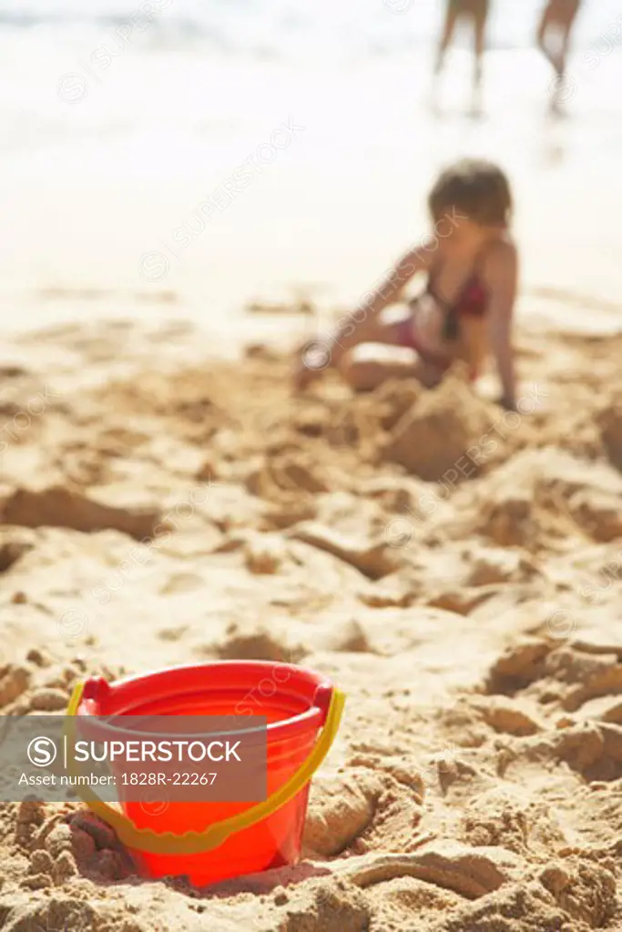 Bucket on Beach, Little Girl Playing in the Sand   