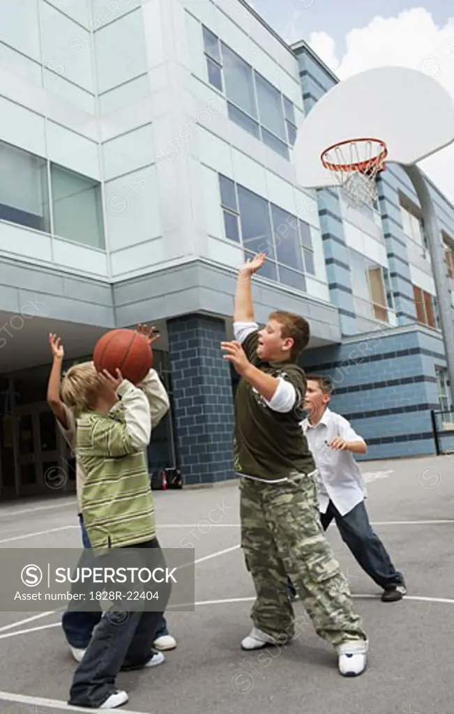 Boys Playing Basketball   