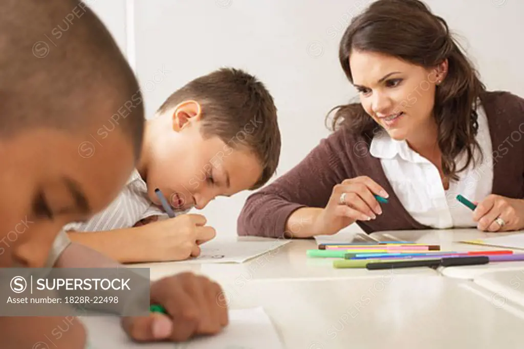 Students and Teacher Drawing in Classroom   