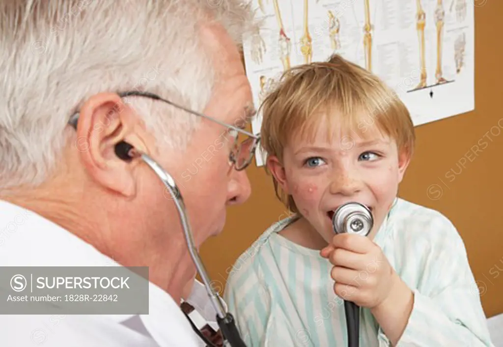 Boy Playing with Doctor's Stethoscope   