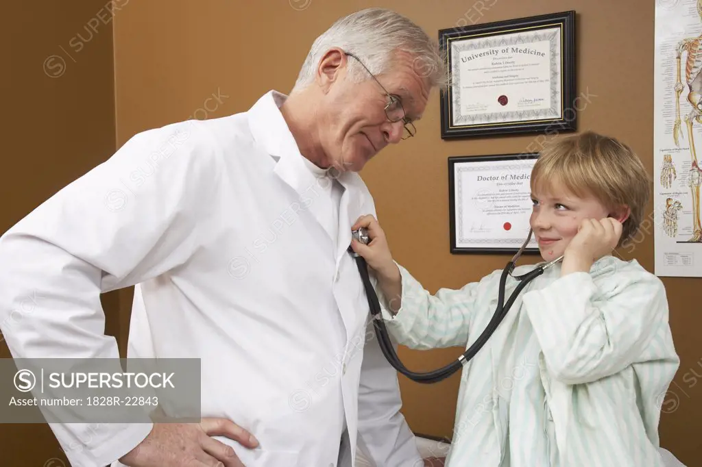 Boy Playing with Doctor's Stethoscope   