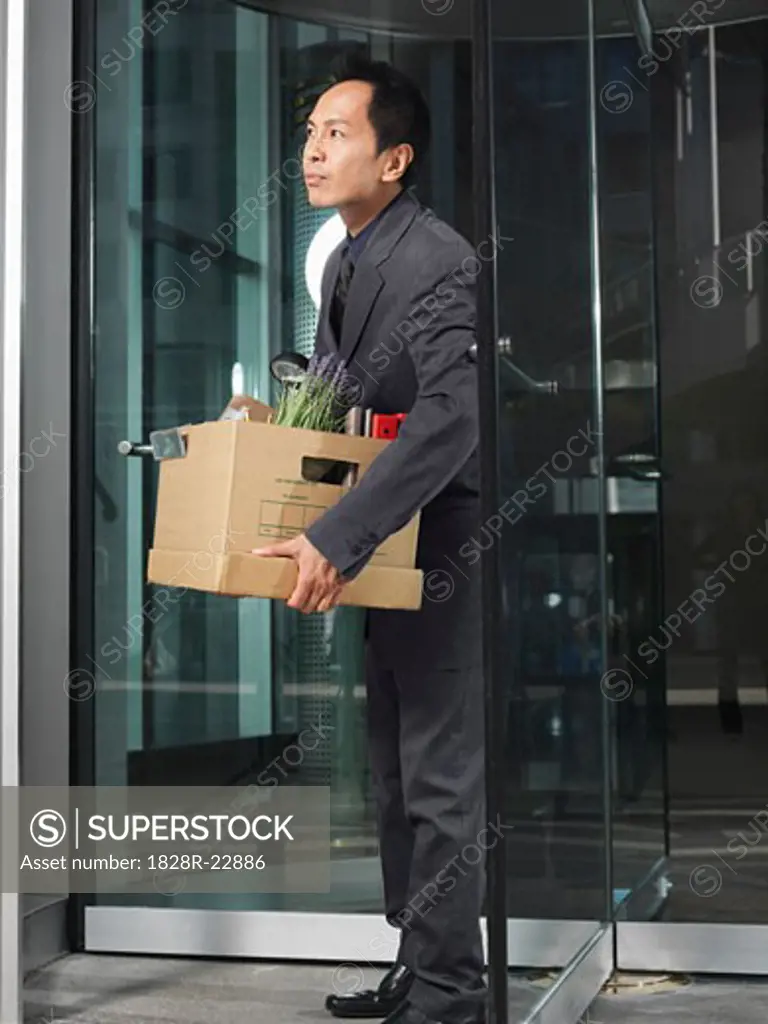 Man Carrying Box   