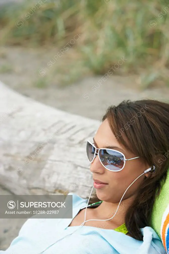 Woman Using MP3 Player   