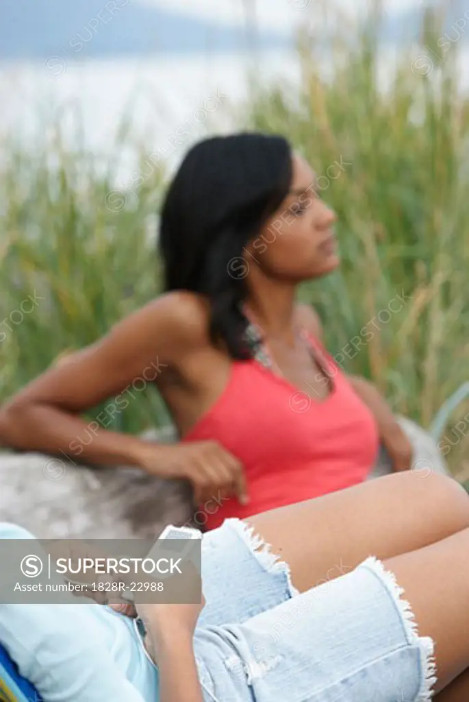 Women Relaxing at Beach   