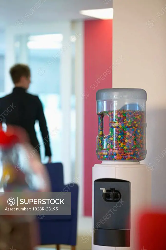 Water Cooler Filled with Candy in Office   