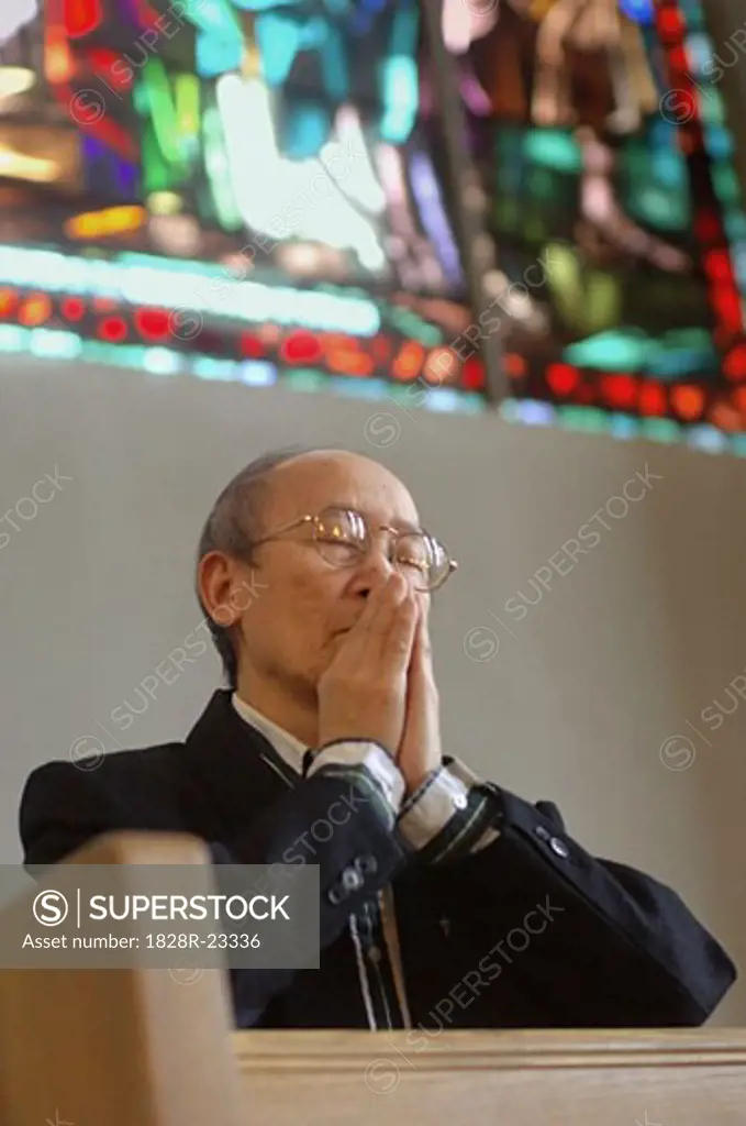 Man Praying Inside Church   