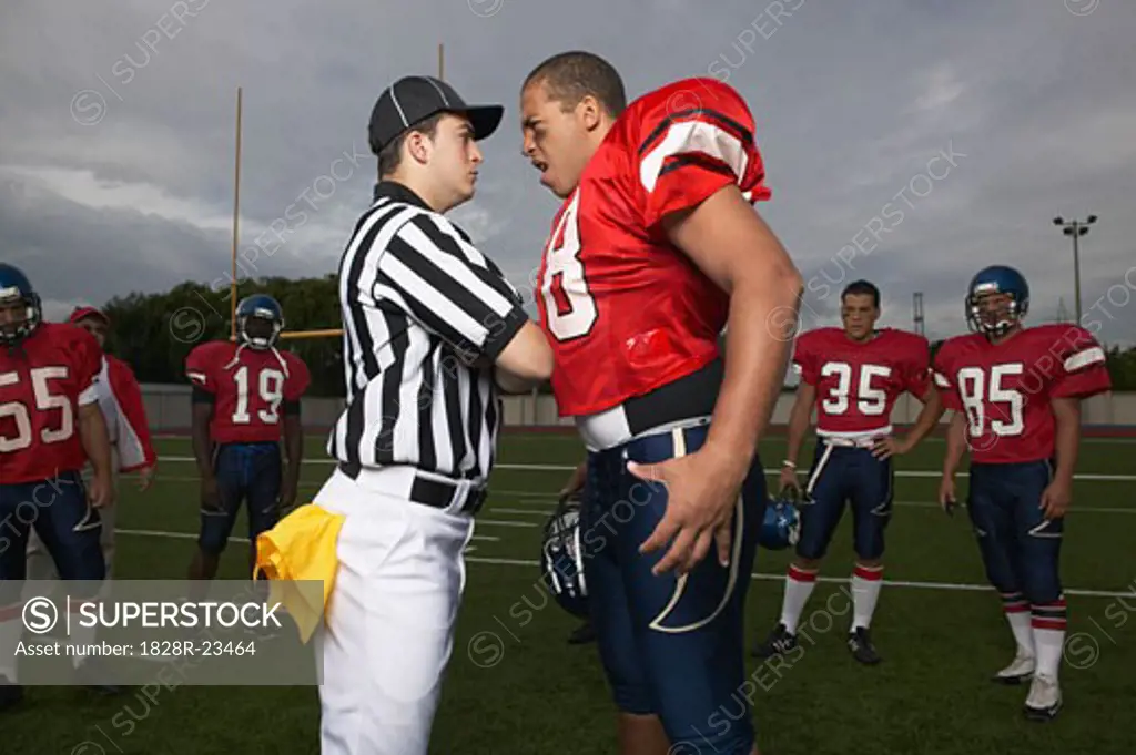 Football Player Arguing with Referee   